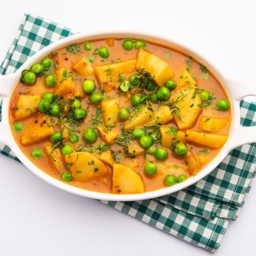 aloo-mutter-is-punjabi-dish-from-indian-subcontinent-which-is-made-from-potatoes-peas-spiced-creamy-tomato-based-sauce_466689-77434