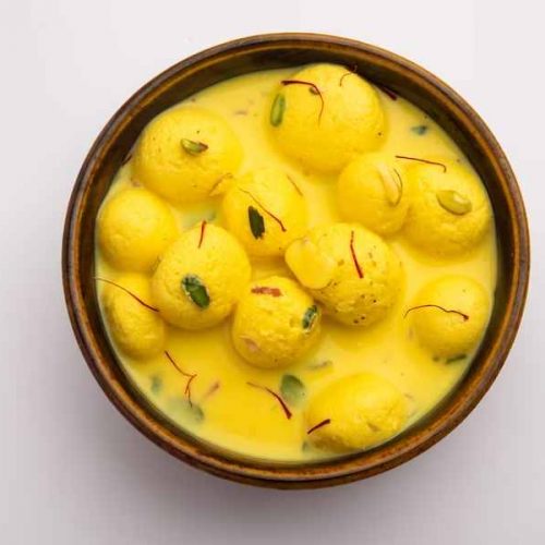 angoori-rasmalai-is-indian-dessert-sweet-with-dry-fruits-saffron-toppings-served-bowl-moody-background-selective-focus_466689-72204